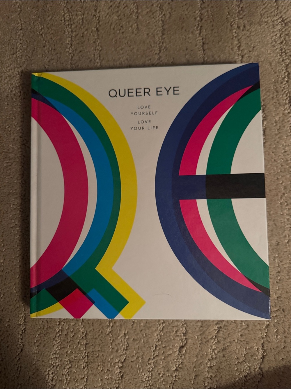 QUEER EYE Hardcover Coffee Table Book - White with Rainbow Accents